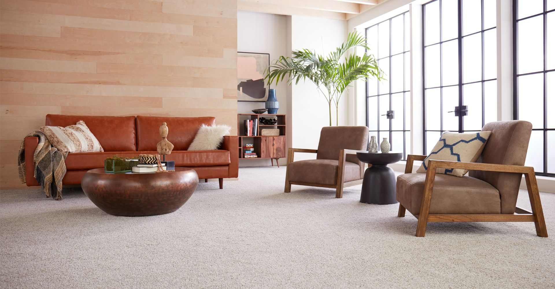 Dad pushing Daughter in Cardboard box on Hardwood Floors in Home.